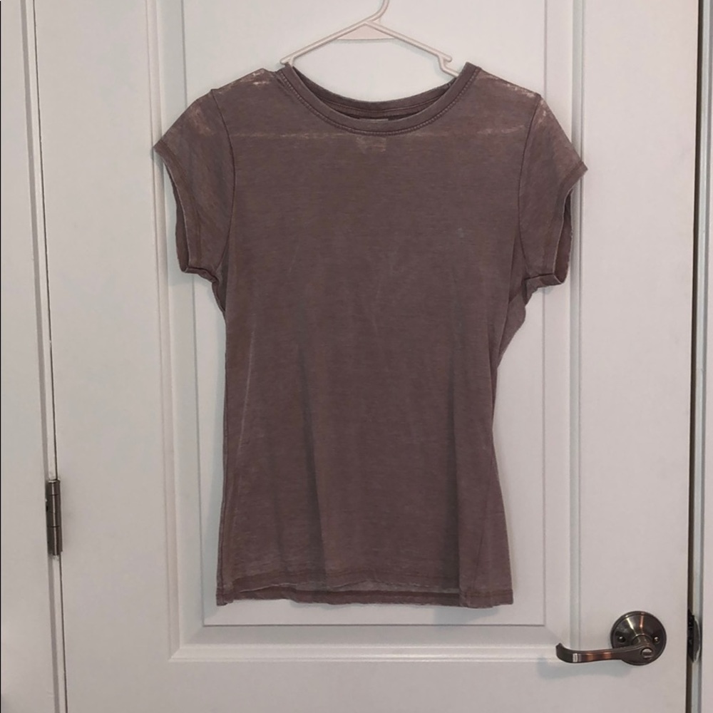 Light pink short sleeved shirt.